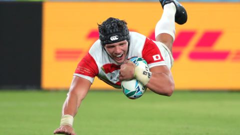 Pieter Labuschagne of Japan scores his team's third try.