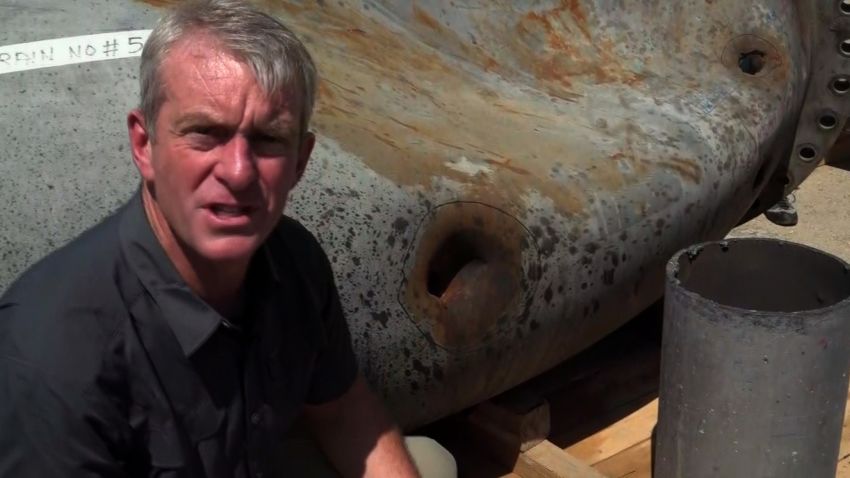 CNN's Nic Robertson surveys shrapnel damage at site of Saudi oil strike.