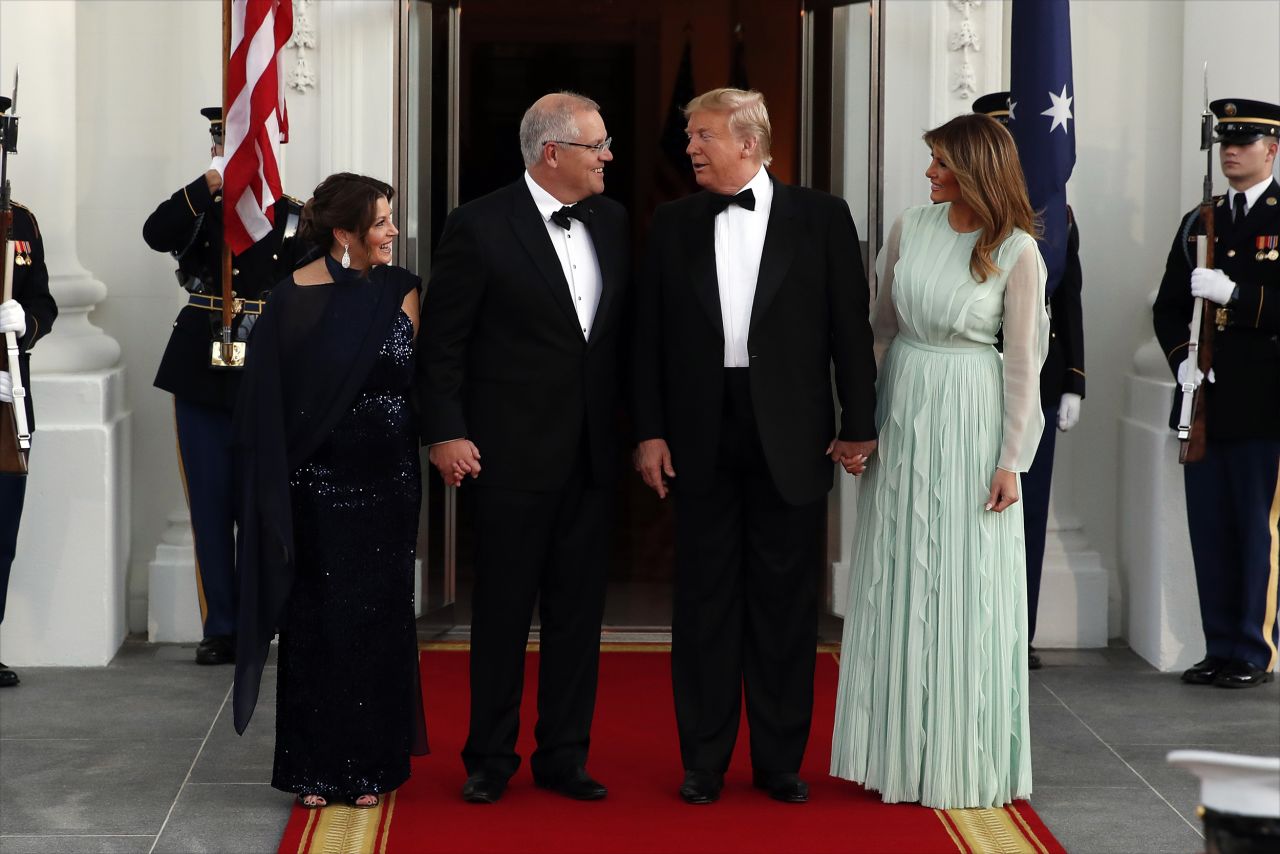 The President and first lady greet the Australian prime minister and his wife  as they arrive.
