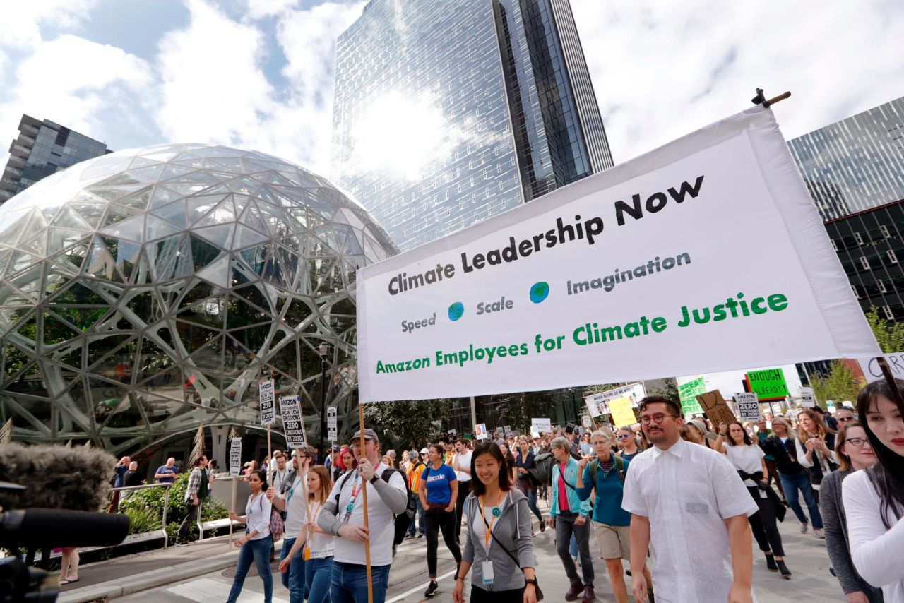 Amazon employees march from the company's headquarters past the campus "spheres" in Seattle.