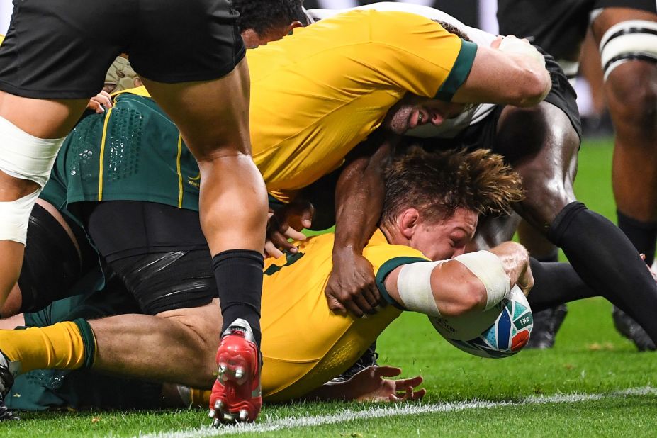 Australia's flanker Michael Hooper scores a first-half try for the Wallabies. "We know them very well, their players and that's what we expected," said Australia coach Michael Cheika. "Probably didn't expect to be as far behind!" he added.