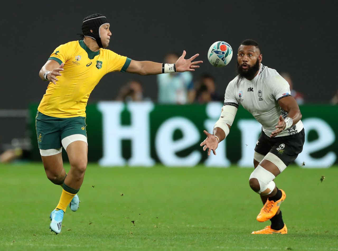 Waisea Nayacalevu (R) of Fiji beats Christian Lealifano to the ball to score a second-half try. However, two tries from Australia hooker Tolu Latu in five minutes ensured the Wallabies avoided a huge upset.