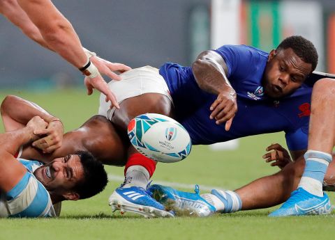 France's Virimi Vakatawa looks to pass the ball to a teammate. France led 20-3 at half-time.