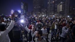 Egyptian protesters shout slogans as they take part in a protest calling for the removal of President Abdel Fattah al-Sisi in Cairo's downtown on September 20, 2019. - Protestors also gathered in other Egyptian cities calling for the removal of President Abdel Fattah al-Sisi but police quickly dispersed them. In Cairo dozens of people joined night-time demonstrations around Tahrir Square -- the epicenter of the 2011 revolution that toppled the country's long-time autocratic leader. (Photo by STR / AFP)        (Photo credit should read STR/AFP/Getty Images)