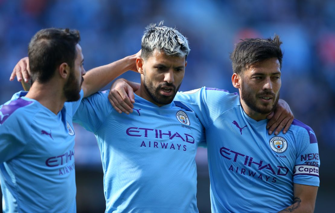 Sergio Aguero (C) celebrates with teammates Bernardo Silva and David Silva after scoring against Watford in an EPL match. 