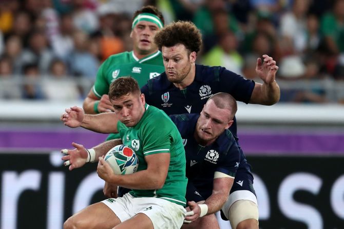 Ireland's wing Jacob Stockdale holds onto the ball under pressure.