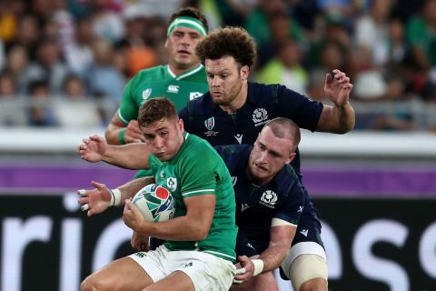 Ireland's wing Jacob Stockdale holds onto the ball under pressure. 