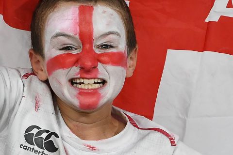 A supporter cheers prior to England's game and Tonga at the Sapporo Dome.