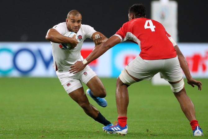 Jonathan Joseph runs past Tonga's Sam Lousi during England's comfortable win. 