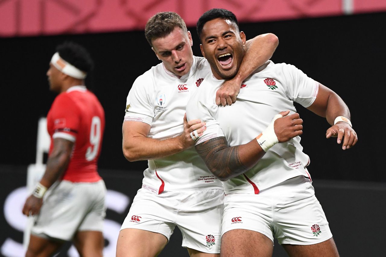 England's centre Manu Tuilagi celebrates with fly-half George Ford after scoring a try.