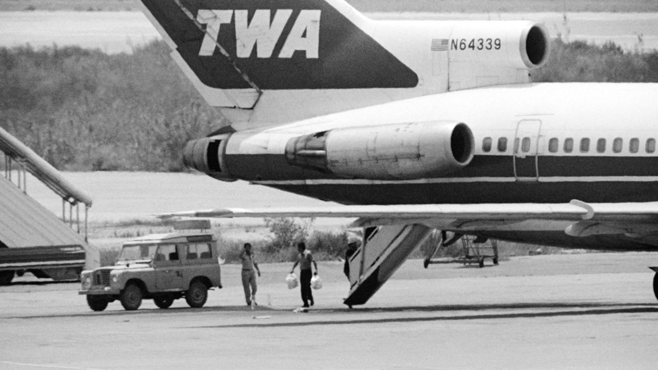 A Lebanese employee at Beirut airport takes bags of sandwiches on board of the American TWA Boeing 727 parked in Beirut airport, on June 17, 1985. Flight 847 of TWA was hijacked on June 14, 1985 by members of Hezbollah and Islamic Jihad shortly after take off from Athens.   AFP PHOTO JOEL ROBINE        (Photo credit should read JOEL ROBINE/AFP/Getty Images)