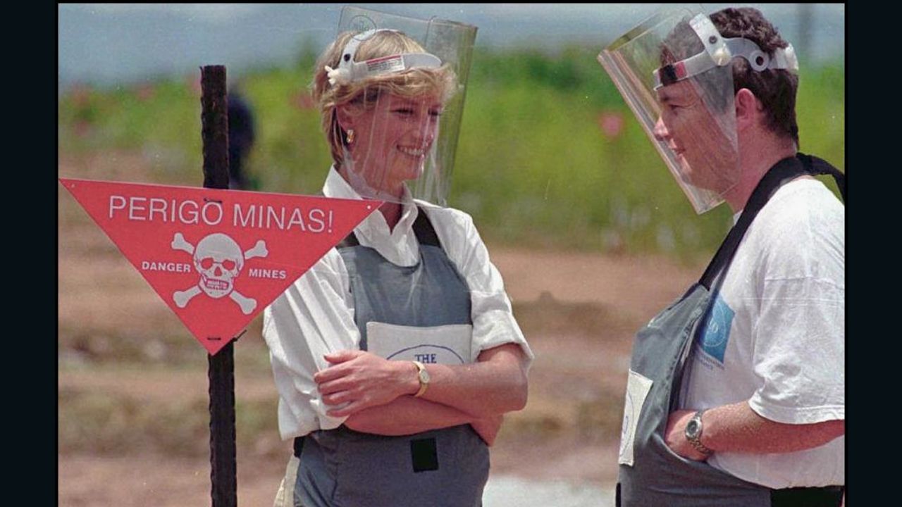 Wearing a heavy duty protection vest and face shield, Princess Diana visits a minefield in Huambo, Angola in 1997.