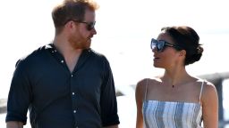 Britain's Prince Harry looks at his wife Meghan, the Duchess of Sussex as they attend a meet-the-people session at Kingfisher Bay Resort on Fraser Island on October 22, 2018. - Prince Harry greeted an Aboriginal community on the stunning World Heritage-listed Fraser Island on October 22 as his pregnant wife Meghan took a break from official duties during the royal couple's Australian tour. (Photo by DARREN ENGLAND / POOL / AFP)        (Photo credit should read DARREN ENGLAND/AFP/Getty Images)