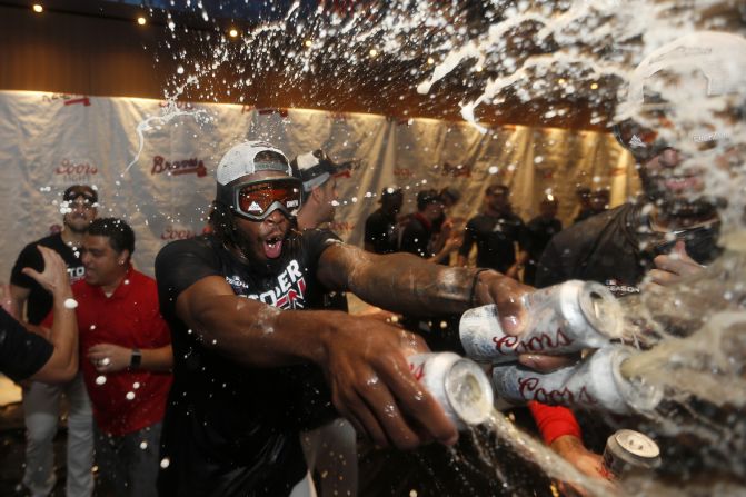 Atlanta Braves relief pitcher Touki Toussaint celebrates in the clubhouse after the Braves defeat the San Francisco Giants to clinch the National League East title in Atlanta, Georgia, on Friday, September 20.