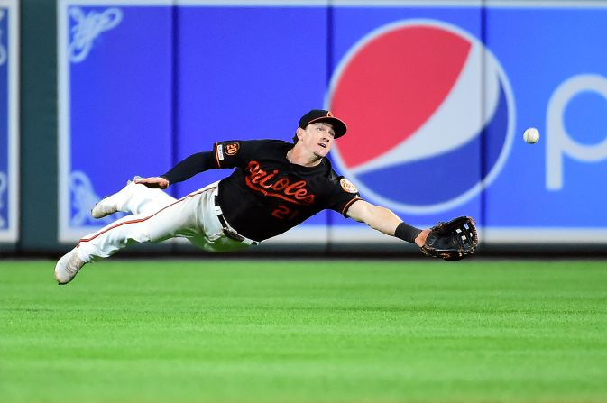 Baltimore Orioles outfielder Austin Hays dives to catch a fly ball in the ninth inning against the Seattle Mariners in Baltimore, Maryland, on September 20.