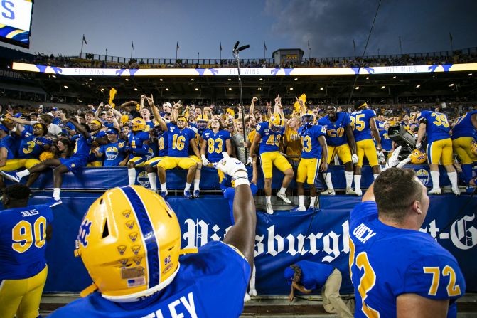 University of Pittsburgh Panthers players celebrate with students during the team's game against the University of Central Florida Knights on September 21, at Heinz Field in Pittsburgh.