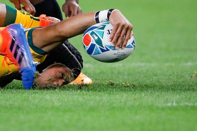 Christian Lealiifano of Australia holds on to the ball during the Rugby World Cup match between Australia and Fiji in Sapporo, Japan, on September 21. This year's Rugby World Cup started September 20 and will continue through November 2.