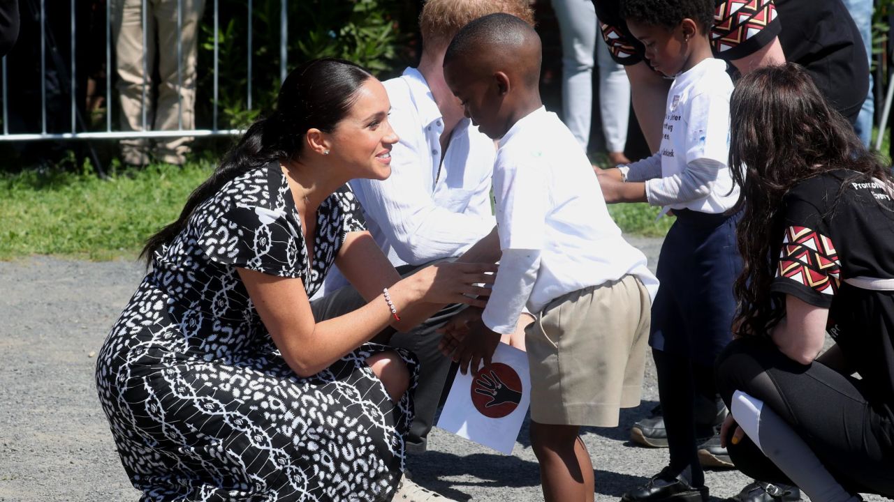 CAPE TOWN, SOUTH AFRICA - SEPTEMBER 23: Meghan, Duchess of Sussex and Prince Harry, Duke of Sussex meet young wellwishers as they visit a Justice Desk initiative in Nyanga township, during their royal tour of South Africa on September 23, 2019 in Cape Town, South Africa. The Justice Desk initiative teaches children about their rights and provides self-defence classes and female empowerment training to young girls in the community. (Photo by Chris Jackson/Getty Images)