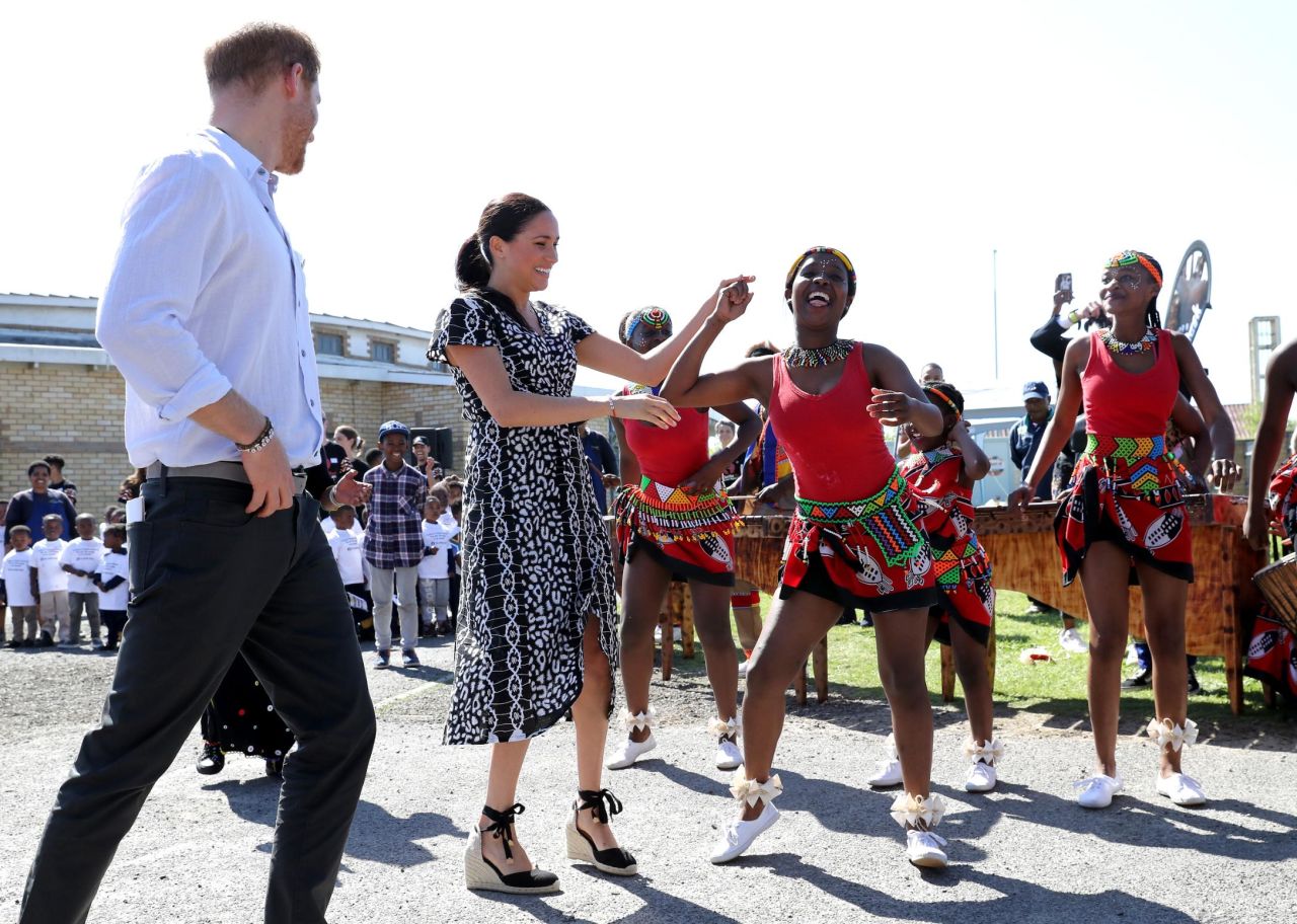 Meghan dances as she and Harry visit Cape Town on September 23.