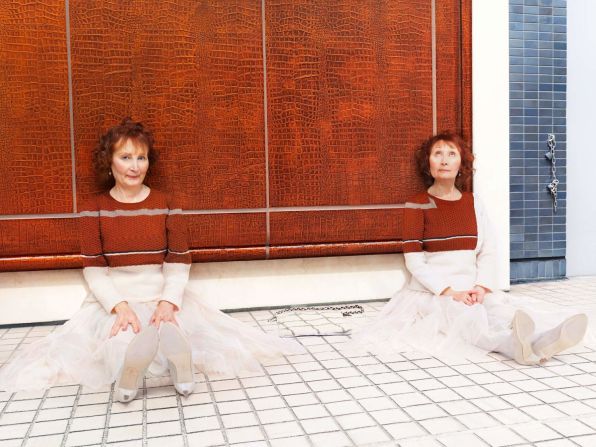 Parisian twins Mady and Monette Marloux have lived together all their lives and always dress the same. For this photo, they acted as each other's mirrors.