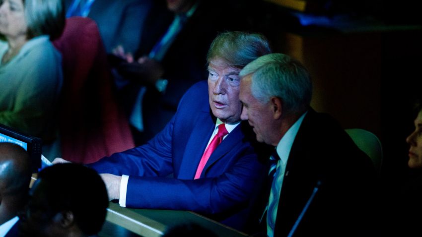 US President Donald Trump and Vice President Mike Pence confer during the UN Climate Action Summit on September 23, 2019 at the United Nations Headquaters in New York City.