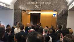Onlookers were turned away from the courtroom after it reached capacity.