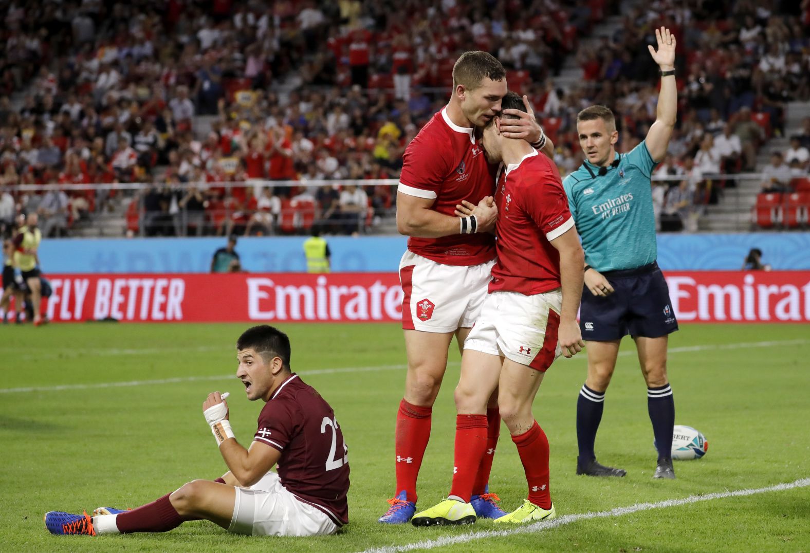 Wales celebrate after scoring yet another try against its opposition which proved it was more than capable of competing on a physical level. 