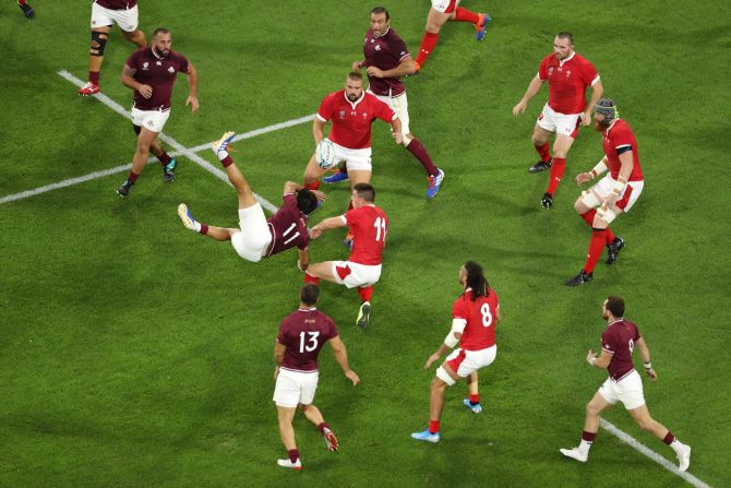 Giorgi Kveseladze and Josh Adams clash as they both attempt to catch the ball in the air.