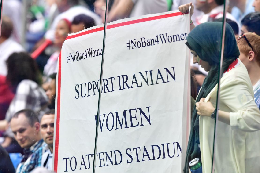 A banner reading "Support Iranian women to attends stadiums" is displayed during the Russia 2018 World Cup Group B football match between Morocco and Iran.