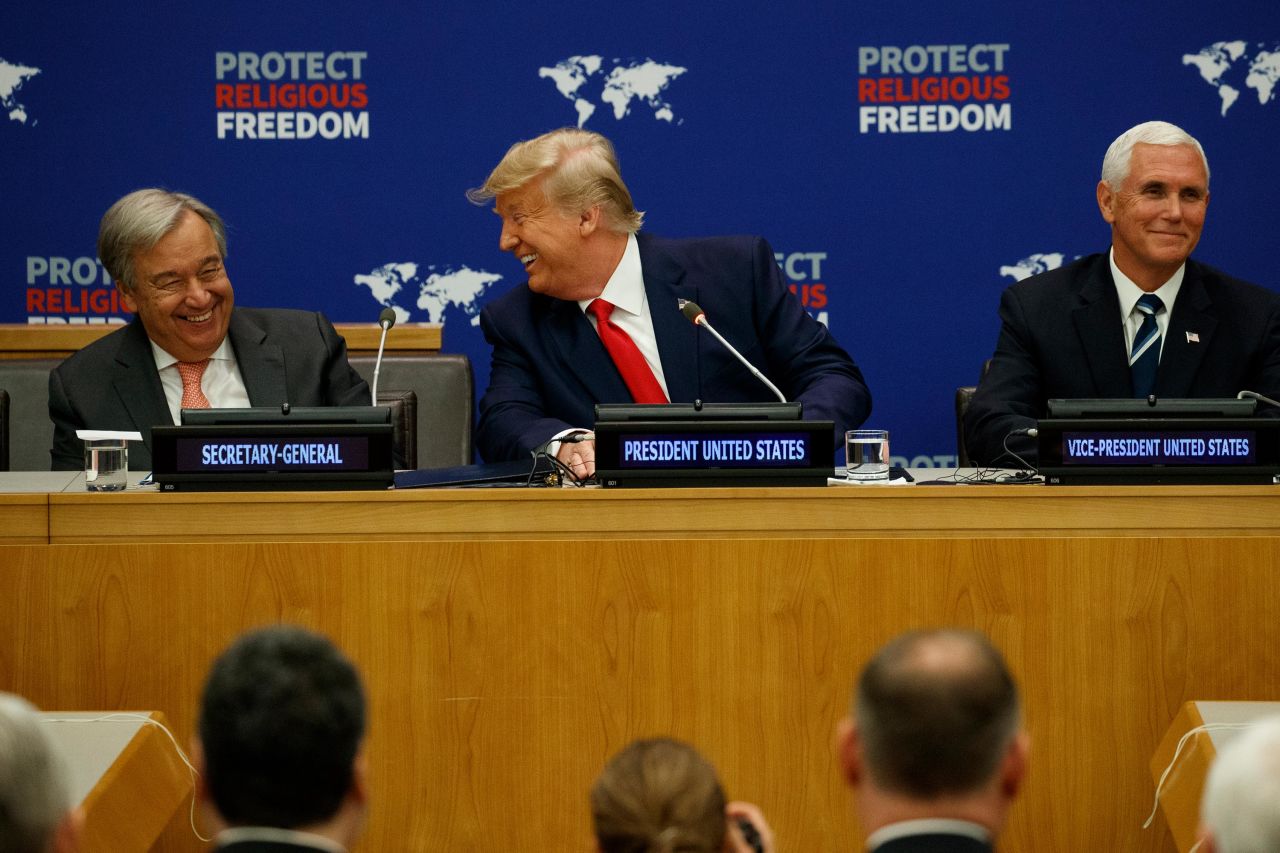 Trump talks with UN Secretary-General Antonio Guterres as Vice President Mike Pence listens during an event on religious freedom on September 23.