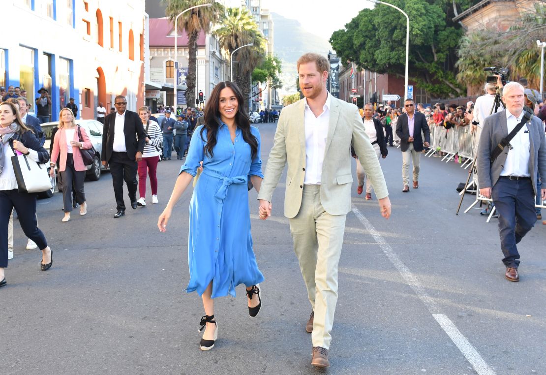 Meghan and Harry visit District 6 Museum in Cape Town, South Africa. Meghan wears a Veronica Beard dress previously seen on the couple's 2018 royal tour of Australia, the Kingdom of Tonga, Fiji and New Zealand. 