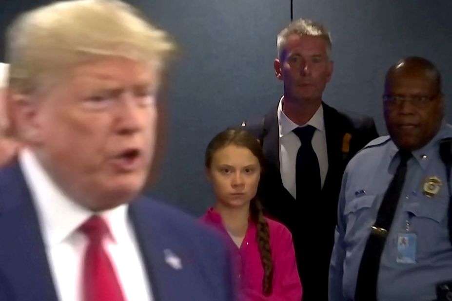 Swedish climate activist Greta Thunberg watches Trump as he enters the United Nations to speak with reporters in September 2019. Thunberg, 16, <a href=