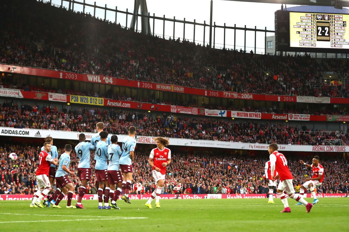 Emerick Aubameyang of Arsenal scores his team's scores his team's third goal against Villa.