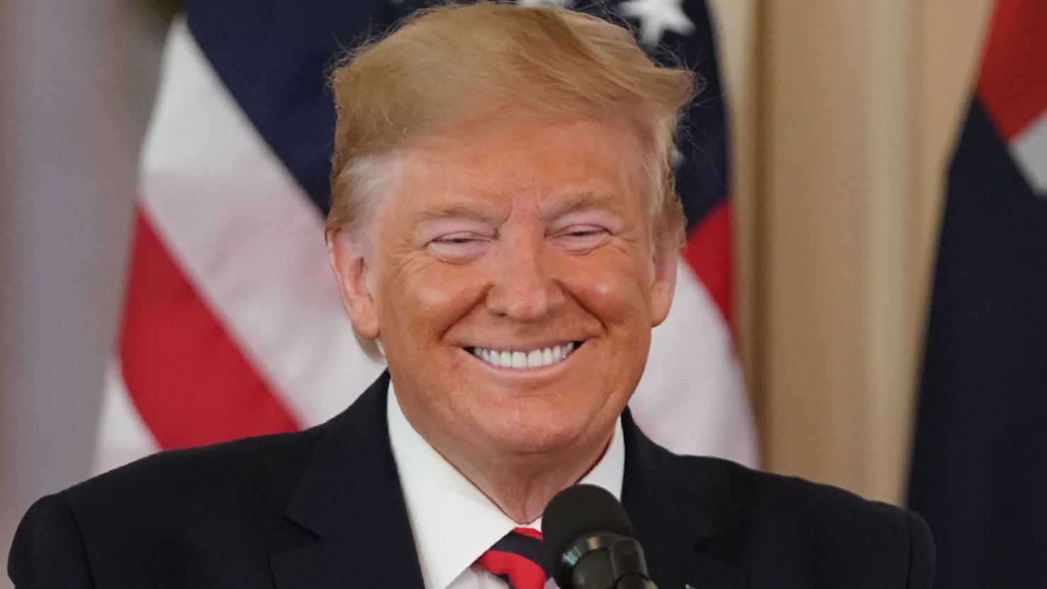 US President Donald Trump smiles during a press conference with Australian Prime Minister Scott Morrison in the East Room of the White House in Washington, DC, on September 20, 2019.