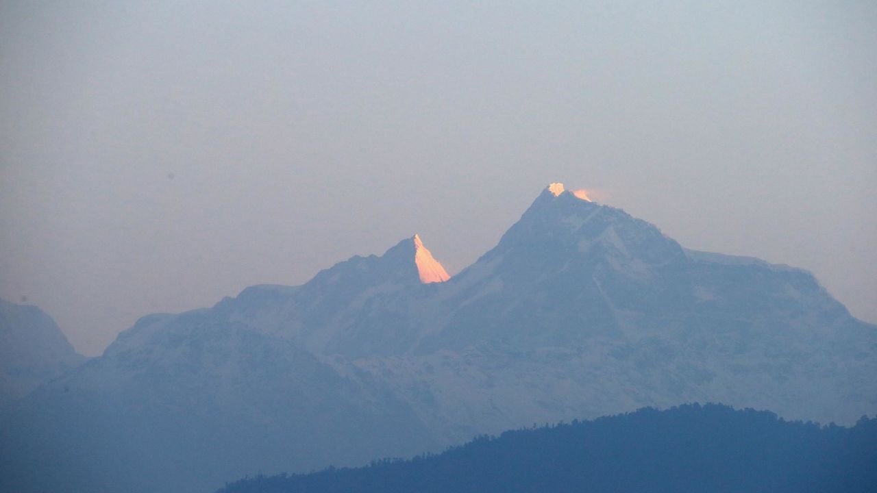 LEORANI, NEPAL - MARCH 22:  First light hits the Himalayas as Prince Harry watches the sun rise after spending the night in the Himalayan  hilltop village of Leorani on day four of his visit to Nepal on March 22, 2016 in Leorani, Nepal. Prince Harry is on a five day visit to Nepal, his first official tour of the country.  (Photo by Chris Jackson - Pool/Getty Images)