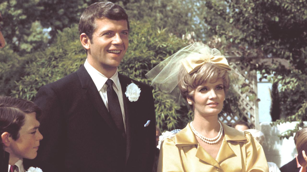 Mike Brady (Robert Reed) and his new wife, Carol (Florence Henderson) on their wedding day in the 1969 pilot for "The Brady Bunch."