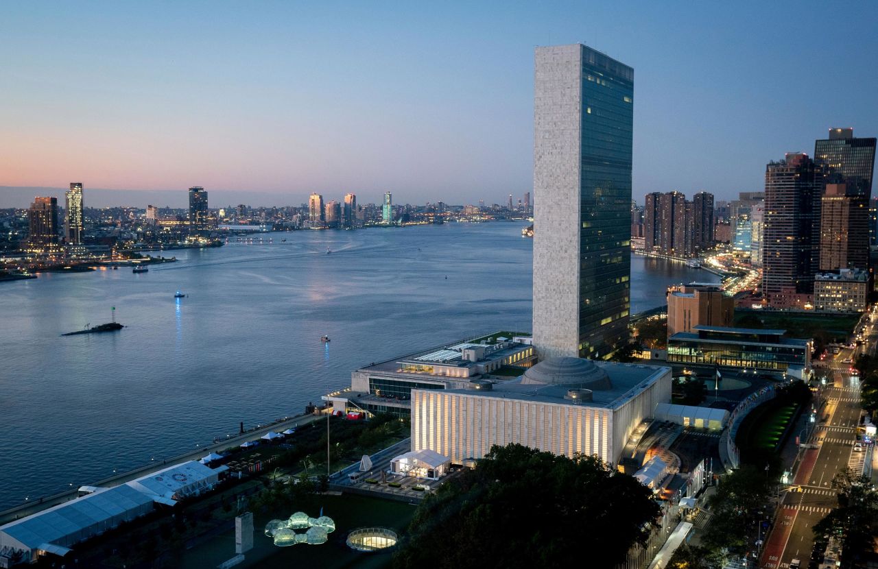 The UN building can be seen as the sun rises in Manhattan on the morning of the start of the UN General Assembly on September 24.