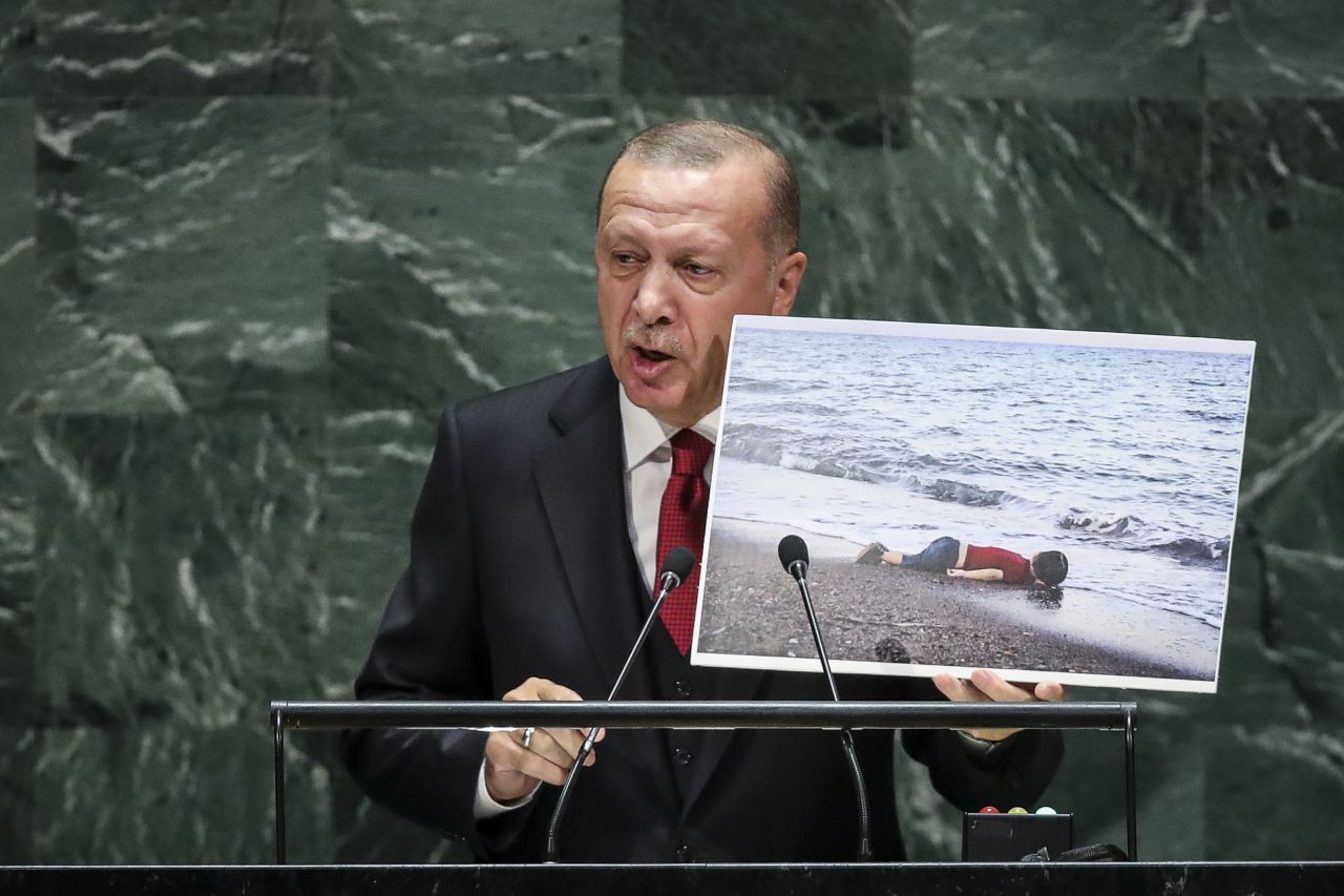 Turkish President Recep Tayyip Erdogan addresses the UN General Assembly on September 24. He is holding up a photo of Alan Kurdi, <a href="https://www.cnn.com/2015/09/02/europe/migration-crisis-boy-washed-ashore-in-turkey/index.html" target="_blank">a young Syrian refugee who drowned</a> in the Mediterranean Sea while he and his family tried to reach Europe in 2015.