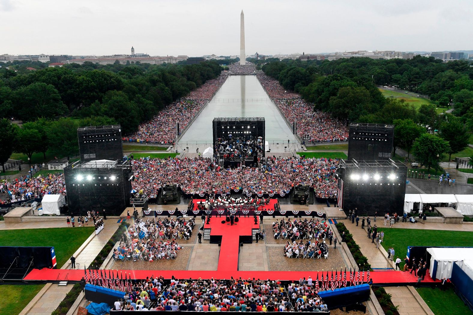Crowds gather around the Lincoln Memorial Reflecting Pool to watch Trump speak in July 2019. <a href="index.php?page=&url=https%3A%2F%2Fwww.cnn.com%2F2019%2F07%2F04%2Fpolitics%2Fgallery%2Ftrump-july-fourth-celebration%2Findex.html" target="_blank">Trump's "Salute to America" ceremony</a> featured military flyovers, music and a largely apolitical speech that struck a patriotic tone. But the event drew considerable scrutiny in the days leading up to it, as <a href="index.php?page=&url=https%3A%2F%2Fwww.cnn.com%2F2019%2F07%2F03%2Fpolitics%2Fmilitary-concerns-trump-july-4th-event%2Findex.html" target="_blank">some felt it was politicizing the military</a>. There were also critics who said the event, <a href="index.php?page=&url=https%3A%2F%2Fwww.cnn.com%2F2019%2F07%2F02%2Fpolitics%2Fvip-tickets-white-house-show%2Findex.html" target="_blank">with its massive VIP section and tickets for political donors,</a> had the sheen of a partisan affair. 