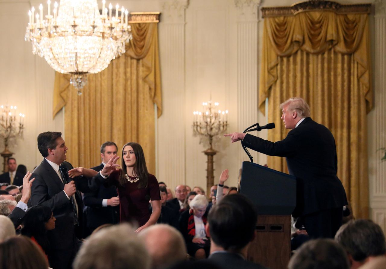 A White House staff member reaches for the microphone held by CNN's Jim Acosta as he questions Trump during a news conference in November 2018. Later that day, in a stunning break with protocol, the White House said that it was <a href="https://www.cnn.com/2018/11/07/media/trump-cnn-press-conference/index.html" target="_blank">suspending Acosta's press pass</a> "until further notice." A federal judge later ordered the White House <a href="https://www.cnn.com/2018/11/16/media/cnn-trump-lawsuit-hearing/index.html" target="_blank">to return Acosta's press pass.</a> 