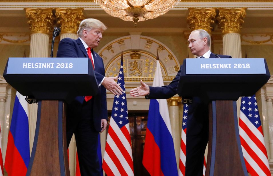 Trump shakes hands with Russian President Vladimir Putin at the end of <a href=