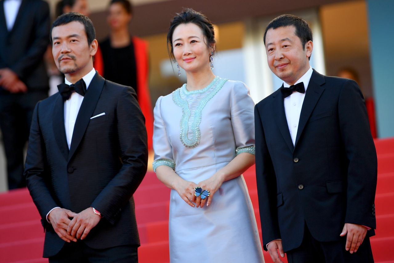 Actors Fan Liao, Zhao Tao and director Zhangke Jia (far right) attend the screening of "Ash Is The Purest White (Jiang Hu Er Nv)" during the 71st annual Cannes Film Festival on May 11, 2018.