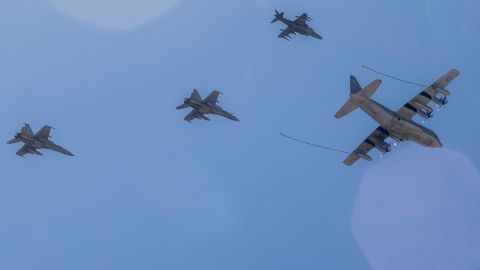 A KC-130J Hercules tanker leads an AV-8B Harrier (top) and two F/A-18 Hornets during a 2017 demonstration in California.