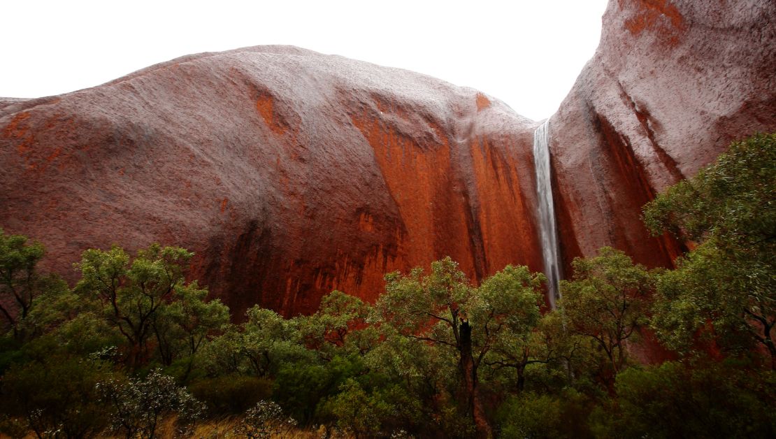 A waterfall cascades into Uluru's Kantju Gorge after a rain shower. 