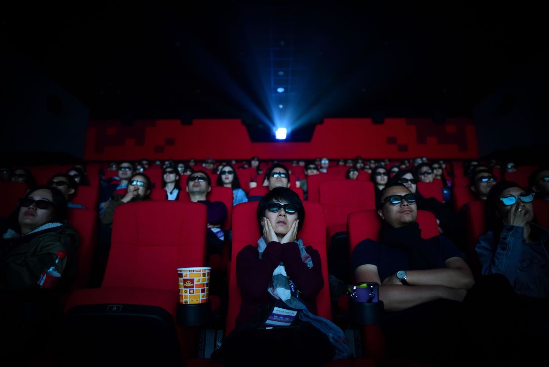 People watch a movie at a cinema in Wanda Group's Oriental Movie Metropolis in Qingdao, China's Shandong province.