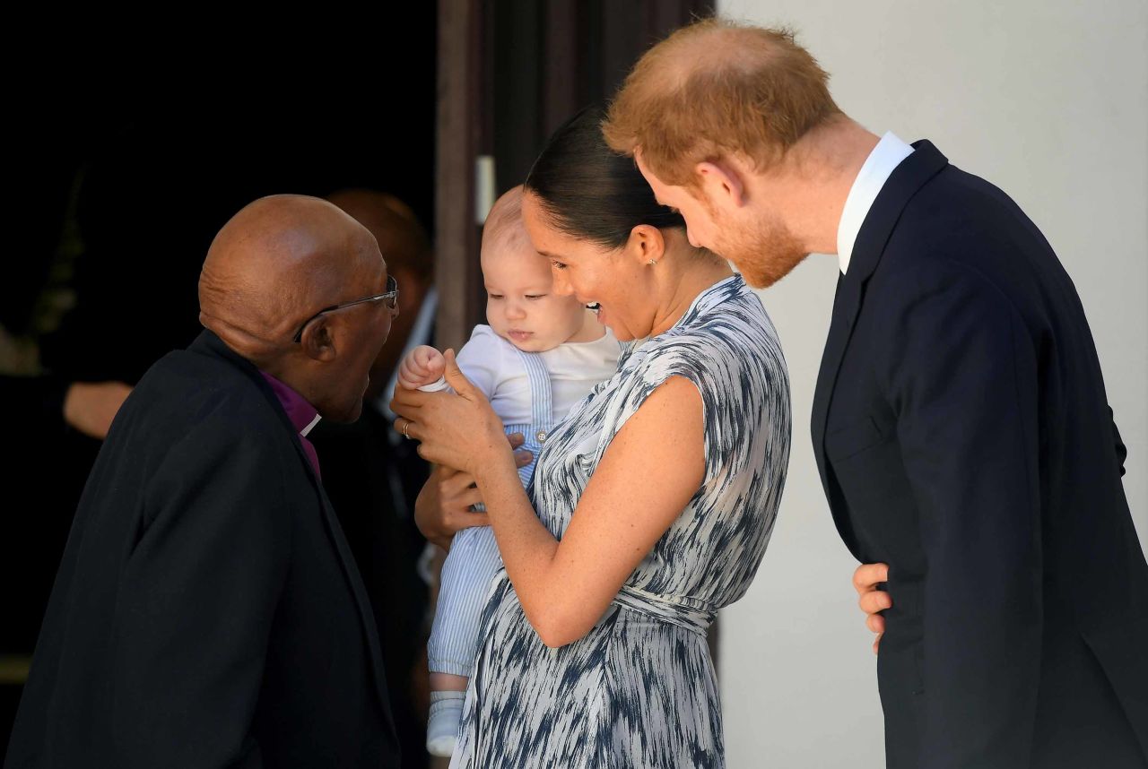 Archbishop Desmond Tutu greets Meghan, Harry and their baby son, Archie, while the family visited Cape Town on September 25.