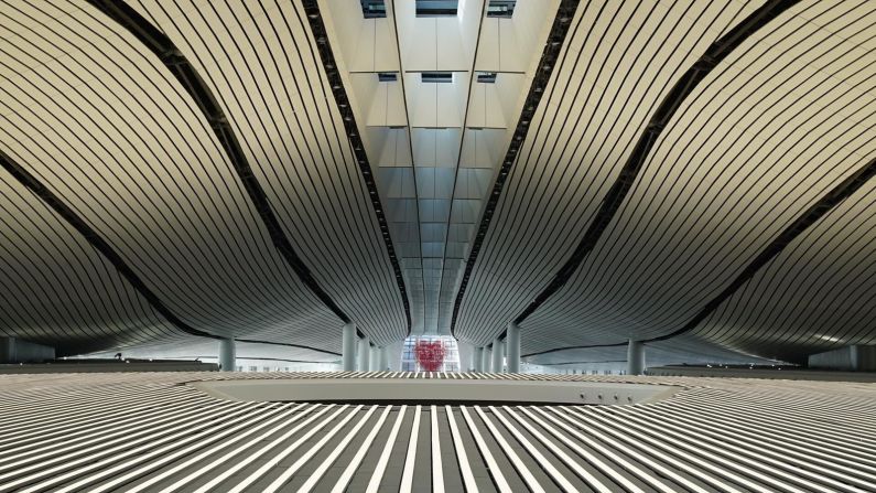 <strong>An airport for the future: </strong>Designed by the late architect Zaha Hadid and her Chinese partners, the airport has a terminal the size of 97 soccer pitches  -- as well as customer-service robots that provide travelers with flight updates and airport information.