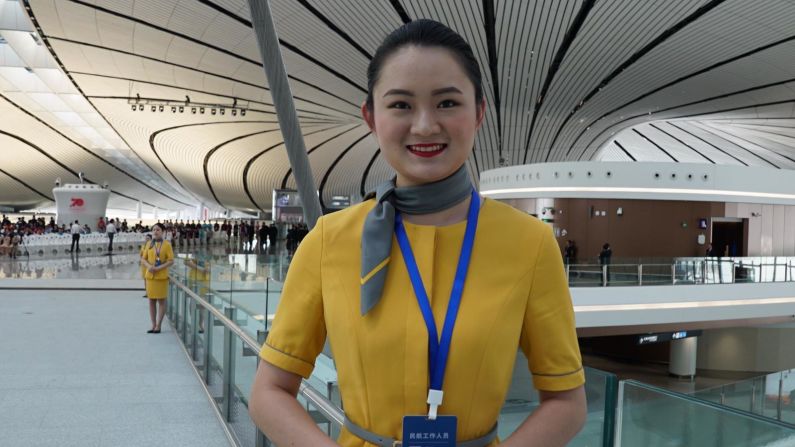 <strong>Ambitious growth targets:</strong> A staff member greets visiting media on opening day at Daxing.<strong> </strong>The "modest" initial operational target at Daxing is to accommodate 72 million passengers and 2 million tons of cargo annually by 2025.
