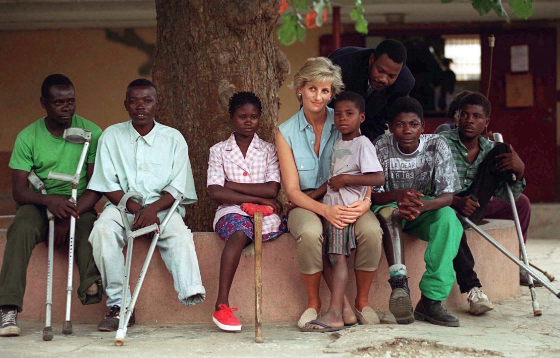 During her visit 22 years ago, the late Princess of Wales, pictured here with children injured by landmines, also visited Neves Bendinha Orthopaedic Workshop In Luanda, Angola.