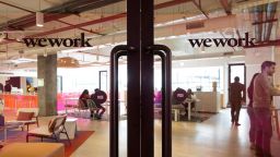 Signage is displayed on glass doors at the WeWork Cos. 32nd Milestone co-working space in Gurugram, India.